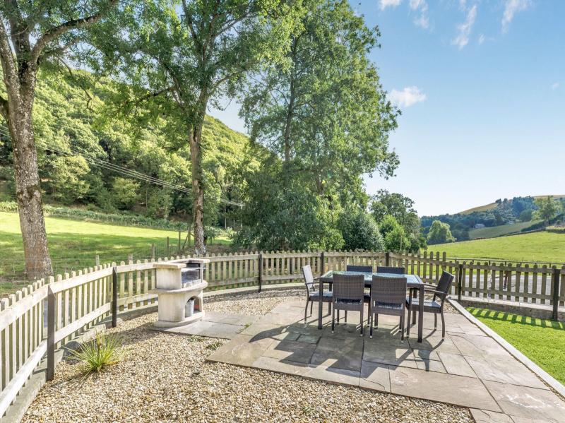 Outside dining area with BBQ